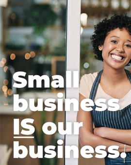 Smiling small business owner in an apron at her shop door with the words: Small business IS our business