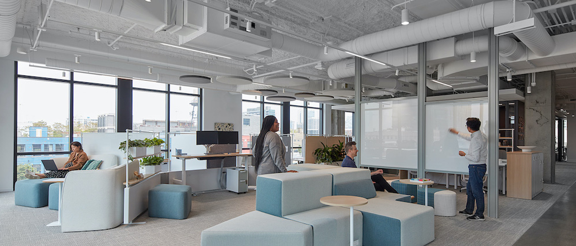 Hero photo: small business team planning their marketing in a bright modern office