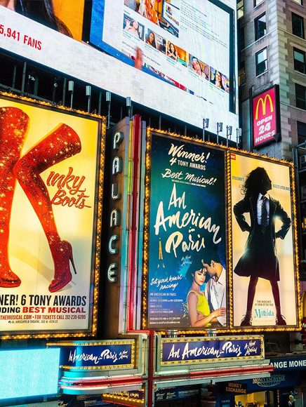 Entertainment: theater billboards lighting up a city entertainment district