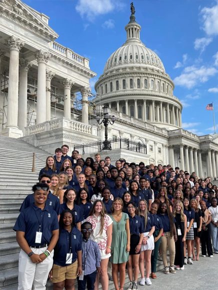 Government and Civic: group of visitors on the steps of a state capitol building
