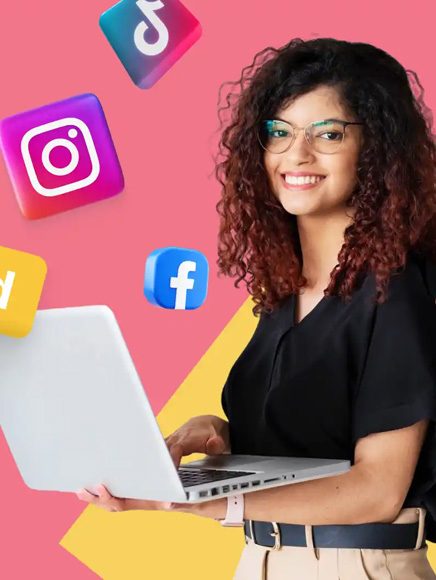Marketing and Advertising: marketer working on social media content on a laptop
